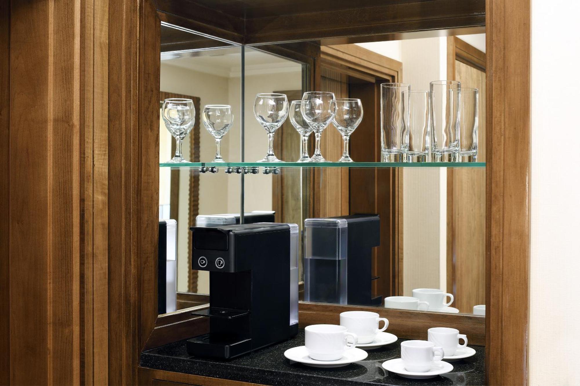 Intercontinental Riyadh By Ihg Kültér fotó A Nespresso machine in a hotel room